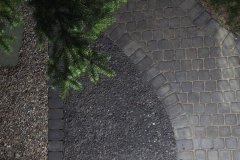 Borders - Charcoal cobble paving stone pathway and mow brick border with 10 mm rundle gravel and 10 mm washed gravel ground cover.
