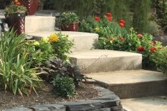 Borders - rundle stack stones retaining wall raised flower bed