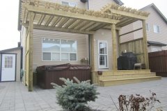 tiered pressure treated pergola with decorative double beams