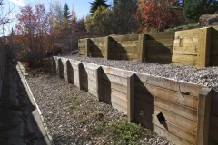 retaining wall - pressure treated tiered wall
