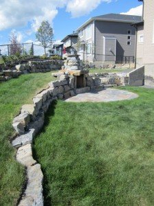 Sage Valley Ironstone Retaining Walls Fireplace and patio