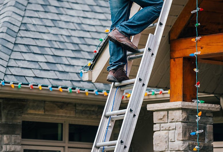 saftery tips climbing a ladder to install christmas lights