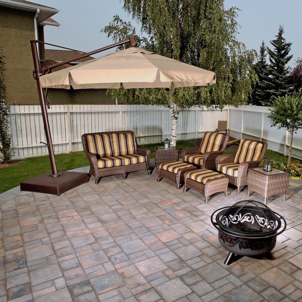 Calgary Patio done in Rocky Mountain pattern pavers in Rustic with outdoor furniture and firepit