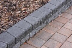 Borders - charcoal stackstone and rustic holland pavers
