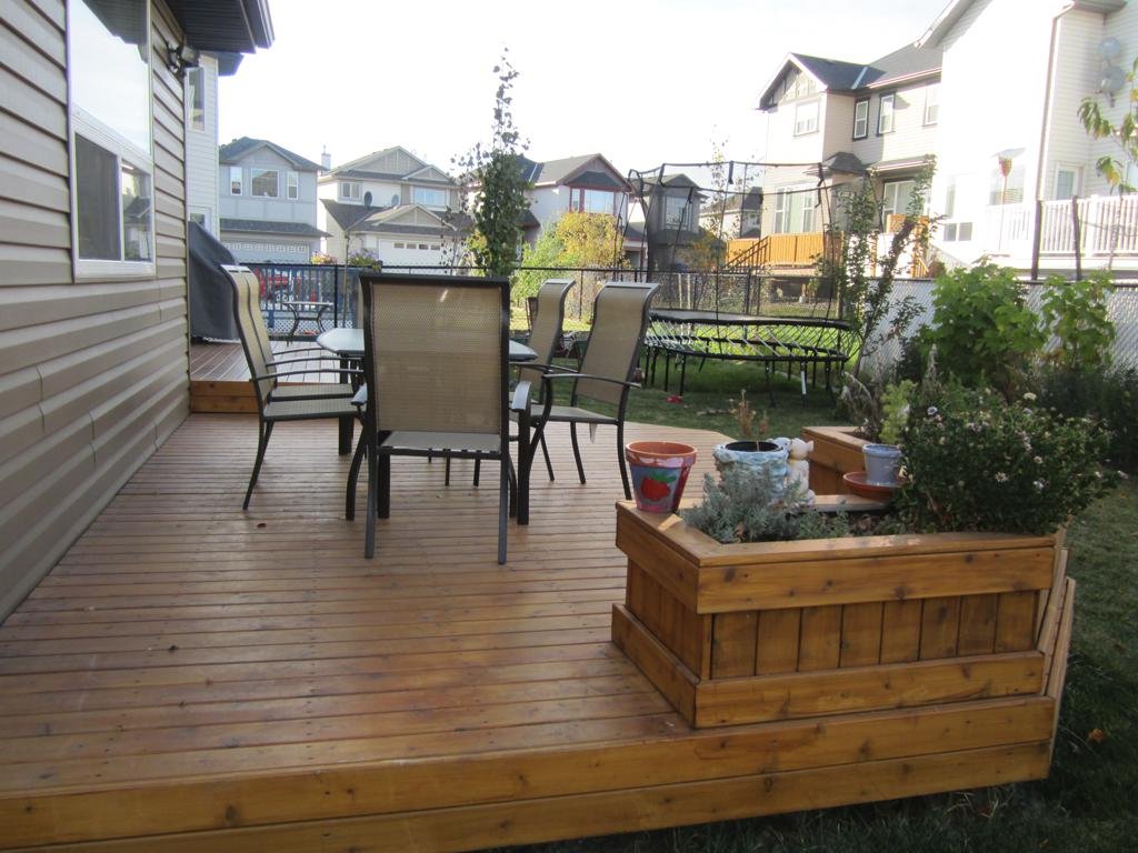 decks - stained cedar deck with built in planters