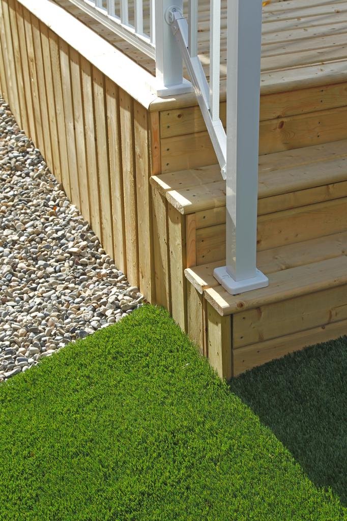 skirting railing - pressure treated deck and stairs with vertical slat skirting and white aluminum railings