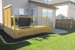 decks - pressure treated deck with black aluminum spindles and lattice skirting