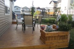 decks - stained cedar deck with built in planters