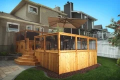 decks - stained cedar deck with custom stairs and skirting with aluminum spindle railings