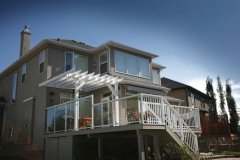 decks - vinyl decking with 58 inch glass and white aluminum railings and painted pergola