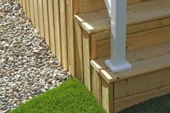 skirting railing - pressure treated deck and stairs with vertical slat skirting and white aluminum railings