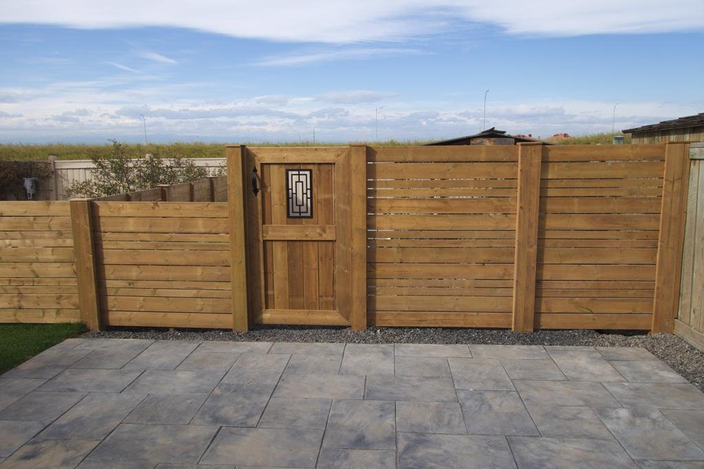 Fences - decorative cedar gate with wrought iron inlay and horizontal slat fence