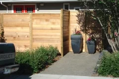 Fences - Horizontal wood fence with minimal space between each board for maximum privacy.
