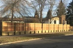 Fences - pressure treated retaining wall topped with cedar fence