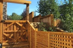 Fences - stained cedar lattice fence with half gate and arbor