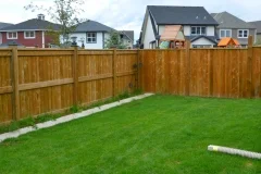 fences - pressure treated fortress style fence with post caps