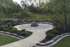 Patio - Mow brick backed up by rundle stone border with exposed aggregate pathway and rundle flagstone patio and rundle dry stack firepit
