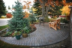 Patio - Rustic cobble paver ying yang with circle pattern incorporated
