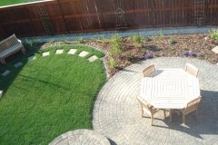 patio - Cobble Stone Patios in Rustic, with fresh sod and mulch perennial beds