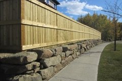 retaining wall - sandstone slab retaining wall with pressure treated fortress style fence