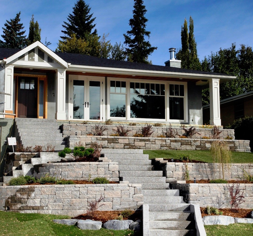 Allan Block Retaining Wall built in Calgary creates a visually appealing and usable terraced front yard.
