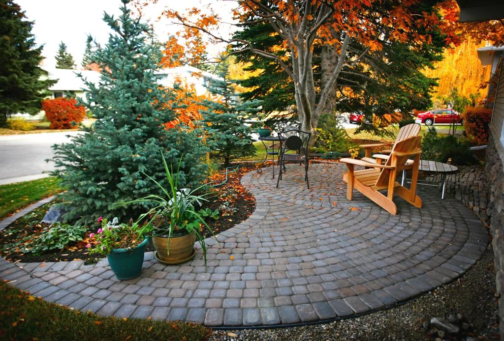 Calgary stone patio built with Rustic cobble pavers in a ying-yang pattern
